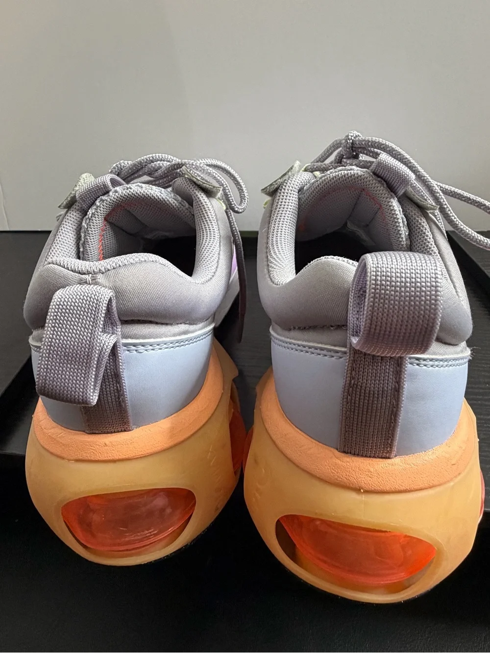 Nike Grey Athletic Sneakers with Black Swoosh and Orange Accents